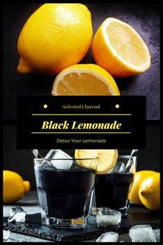 two glasses filled with black lemonade next to sliced lemons