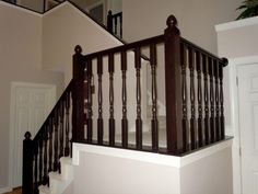 the stairs are made of wood and have handrails