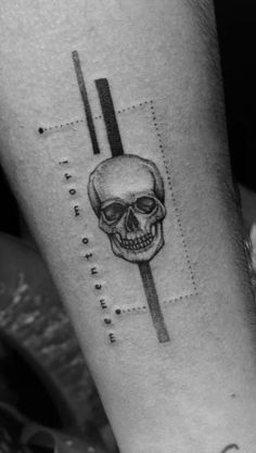 a black and white photo of a skull on the arm with lines coming out of it