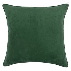 a green velvet pillow on a white background