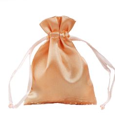 an orange satin bag on a white background