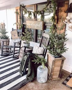 the porch is decked out with christmas decorations