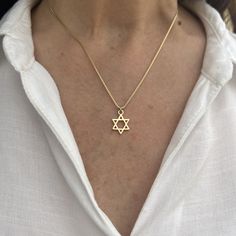 "The Gold Star of David Necklace is a stunning piece of jewelry that symbolizes Jewish heritage and faith. Crafted in radiant gold, this necklace features the iconic Star of David charm, representing unity, protection, and an eternal connection with God. It serves as a meaningful gift and a cherished symbol of love and support for those celebrating Jewish culture. ❤ 𝗠𝗘𝗔𝗦𝗨𝗥𝗘𝗠𝗘𝗡𝗧𝗦 ❤ Pendant width: 0.47\"/ 1.2 cm. Pendant length: 0.47\"/ 1.2  cm. Made of high-quality 24k gold plated brass Please choose your length from the drop-down list. ❤ 𝗠𝗬 𝗦𝗧𝗢𝗥𝗘 ❤ For more Judaica pendant necklaces: http://bit.ly/3UBSknF Back to my shop:  https://etsy.me/2ZBJCus ❤ 𝗔𝗕𝗢𝗨𝗧 𝗠𝗬 𝗟𝗜𝗧𝗧𝗟𝗘 𝗦𝗧𝗢𝗥𝗘 ❤ *This jewelry was made solely by me.* *If you have any questions or requests do no Star Of David Necklace Aesthetic, Star Of David Bracelet, Star Of David Jewelry, Gold Star Of David Necklace, Judaism Aesthetic, Magen David Necklace, Jewish Star Necklace, Connection With God, Jewish Necklace