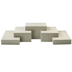 six square concrete blocks stacked on top of each other in the shape of rectangles