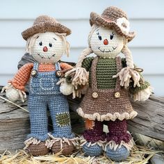 two crocheted scarecrows standing next to each other on straw bales