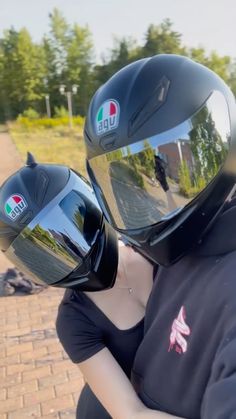 a man and woman wearing helmets on their backs