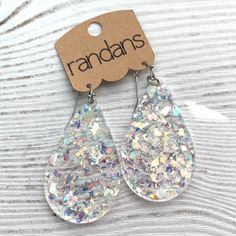 Randans glitter earrings are the lightest, most comfortable earrings your customers will ever buy! They will quickly become collectors. All earwires are hypoallergenic stainless steel. These earrings are handmade. From the mold making process to the assembly of the earring. Each individual earring is handpoured resin batch mixed with glitter. It is a liquid art. There is no guarantee color, shape, pattern will be as photographed. There will occasionally be minor imperfections due to this process Trendy Silver Glitter Earrings, Glitter Teardrop Earrings For Gifts, Glitter Teardrop Earrings As Gift, Silver Glitter Teardrop Earrings, Clear Hypoallergenic Resin Earrings, Hypoallergenic Clear Resin Earrings, Clear Resin Earrings, Comfortable Earrings, Liquid Art