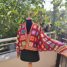 🌸🌸Crochet Granny Square Cardigan - Colorful Patchwork Design🌸🌸 🌸Stay Cozy and Stylish! 🌸Our handmade Crochet Colorful Granny Square Cardigan brings together retro charm and modern style. Featuring vibrant colors and a patchwork design, this cardigan is the perfect addition to your wardrobe, offering both warmth and a bold, unique look. Ideal for cooler days when you want to stay cozy and fashionable. 🌸Handmade Granny Square Design: Classic granny square motifs crafted with vibrant colors Red Patchwork Long Sleeve Cardigan, Red Long Sleeve Patchwork Cardigan, Bohemian Multicolor Crochet Top For Fall, Multicolor Bohemian Crochet Top For Fall, Red Long Sleeve Cardigan For Festivals, One Size Multicolor Granny Square Cardigan, Multicolor Granny Square Cardigan One Size, Vintage Multicolor Granny Square Outerwear, Festival Long Sleeve Patchwork Cardigan