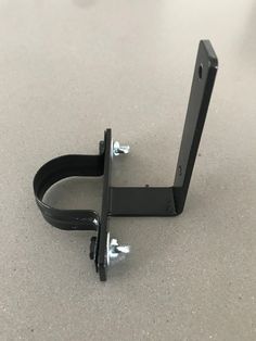 a pair of black brackets on the floor