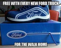 a pair of shoes sitting on top of a blue box with the caption free with every new ford truck for the walk home