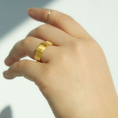 Like a band unearthed from centuries past, the faceted Ode Ring is fully customizable with hand-engraved lettering. Prounis jewels are made with a custom shade of the ancient 22-karat alloy. Each piece begins with a soft matte finish, and over time the wearer’s skin will polish the metal, creating a lustrous velvety shine. Matte Gold Brass Rings As Gifts, Matte Gold Brass Rings For Gift, Gold Thick Band Jewelry For Promise, Matte Gold Open Ring Perfect As A Gift, Matte Gold Open Ring For Gift, Minimalist Wide-band Promise Jewelry, Minimalist Wide Band Promise Jewelry, Modern Gold Signet Promise Ring, Minimalist Engraved Gold Ring In Recycled Gold