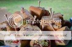 a pile of sandwiches sitting on top of a green plate