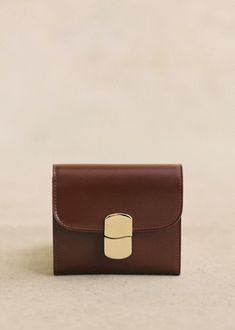 Item made in our Italian atelier;Smooth patent-effect leather exterior;Leather lining;Fastens with a metal clasp in a light gold finish;Inner zipped pocket and patch pocket - Patch pocket on the back;Weight: 115 g / 4.06 oz;Dimensions: 9 x 2 x 10,5 cm / 3.5 x 0.8 x 3.9 in Iced Chocolate, Lifestyle Dresses, Denim Suit, Swimwear Dress, Basket Bag, Best Bags, Small Wallet, Small Leather Goods, Parisian Style