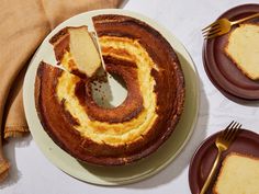 a bundt cake on a plate with two slices cut out