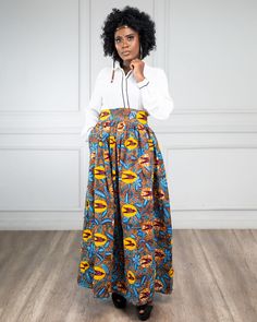 This beautiful skirt is made with 100% African print fabric. it measures 43 inches  long.It has elastic  and a zipper on the back . This skirt is high  waist and fits better when  the band is under your bust.   .############################################################################################################################################################  COLD WASH ONLY. SASH side pocket  Zip Closure Elastic CARE INSTRUCTIONS:  Dry Clean Recommended DO NOT BLEACH Press with warm iron  Cold wash only Size ChartInches Size XS (US S 0-2) 24-25 Size S (US S 4-6) 28-30 Size M (US S 8-10) 31-33 Size L (US 12-14) 34-36 Size XL (US 14-16) 36-38 Size XXL (US 16-18) 38-40 Size 3XL(US 18-22) 40 - 45 High Waist Maxi Skirt With Elastic Waistband, High Waist Floral Print Maxi Skirt In Relaxed Fit, High Waist Relaxed Floral Maxi Skirt, Multicolor Flowy High Waist Maxi Skirt, Printed Relaxed Fit Maxi Skirt, High Waist Floral Print Maxi Skirt, Womens Skirts, Beautiful Skirt, African Print Fabric