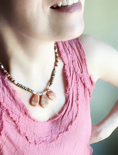 This statement necklace features a sweet color combination of soft orange with other natural colors. The focal beads are carnelian and are stunning! Many of the beads have an earthy, textured look.  This piece can be dressed up or dressed down. made with love namaste F O L L O W Facebook: https://www.facebook.com/funkyearthstones Instagram: @myominspirations Pinterest: @darlenebink Brown Gemstone Beads Nature-inspired Necklace, Nature-inspired Brown Gemstone Bead Necklace, Earthy Agate Beaded Necklaces, Earthy Brown Agate Beaded Necklaces, Earthy Natural Stone Necklaces, Earthy Brown Agate Beaded Necklace, Bohemian Brown Necklace With Natural Variations, Bohemian Orange Necklaces With Natural Stones, Rustic Brown Gemstone Bead Necklaces