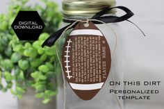 a mason jar with a football tag on it