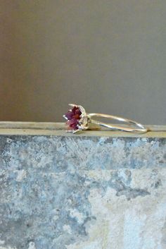 Rough Ruby ring in sterling silver. My best selling lotus flower design is finally available in raw Ruby! A handcrafted .925 sterling silver or 14k white gold band and bright silver cup filled with raw Ruby chips in a mosaic pattern, my signature design. Organic, natural ruby reds in varying shades look pretty and unique next to the bright silver. Ruby is July's birthstone. Made to order, custom ring. I love this ring as sparkly, any occasion present for her, Women's May birthstone gift for her, Valentines Theme, Lotus Flower Jewelry, Raw Ruby, Lotus Flower Design, Present For Her, Valentine Theme, Presents For Her, Birthstone Gifts, July Birthstone