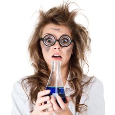 a woman wearing glasses holding a bottle with liquid in it and looking surprised at the camera