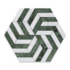 a green and white marble hexagonal tile with an abstract design in the center