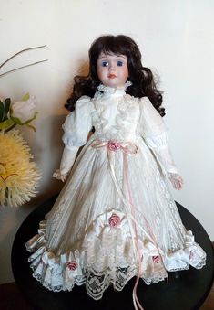 a doll is sitting on top of a table