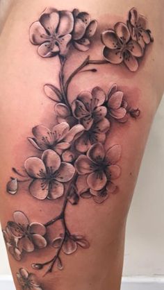 a woman's thigh with flowers on it