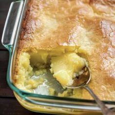 a close up of a casserole with a spoon in it