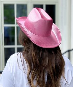 Introducing our "Long Live Cowgirls Hat" in Pink, the ultimate accessory for every cowgirl and country concert enthusiast! Crafted with iridescent glitter, this cowboy hat adds a touch of sparkle and flair to your western-inspired ensemble.
Whether you're two-stepping at a country concert, line dancing at a western-themed party, or simply embracing your cowgirl spirit, this hat is sure to make you stand out in the crowd. The vibrant Pink color adds a playful and feminine touch, perfect for adding a pop of color to your outfit.
With its classic cowboy hat design and shimmering glitter finish, our "Long Live Cowgirls Hat" is the perfect way to show off your country girl pride in style. Pair it with denim shorts and boots for a chic and effortless look that's ready for the dance floor.
So why Western Style Fedora For Party, Western Adjustable Costume Hats For Parties, Western Wide Brim Fedora For Party, Western Style Fedora With Curved Brim For Parties, Western Fedora With Curved Brim For Parties, Western Curved Brim Costume Hat For Parties, Fitted Western Party Hats, Western Summer Party Fedora, Western Style Summer Party Fedora