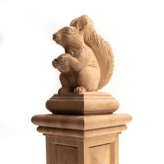 a statue of a squirrel on top of a pedestal