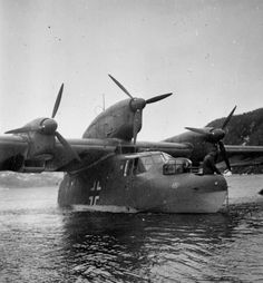 an old airplane is sitting in the water