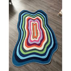 a multicolored area rug on the floor