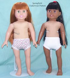 two dolls are standing next to each other on a blue background and one is wearing a diaper