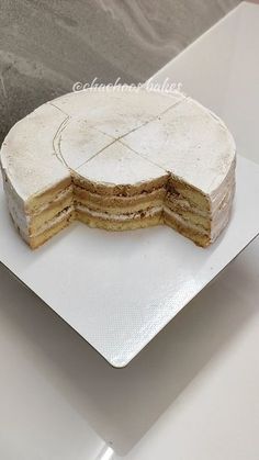 there is a cake that has been cut in half on the plate and ready to be eaten