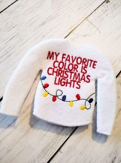 a white shirt that says, my favorite color is christmas lights on the front and back