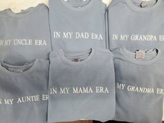 four t - shirts with the words in my dad era printed on them are lined up next to each other