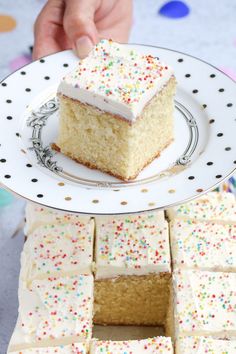 a piece of cake sitting on top of a white plate next to other pieces of cake