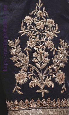 an embroidered jacket with gold thread work on it