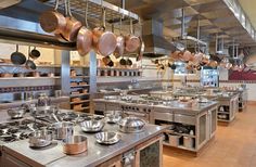 a large kitchen filled with lots of pots and pans