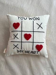 a pillow with hearts on it that says you won't play my heart,