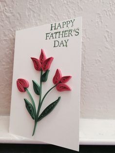 a father's day card with red flowers on it