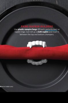 a black plate with a red cloth on it and a white toothbrush in the middle