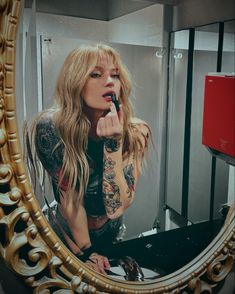 Blonde hair girl looking into mirror putting lipstick on like the bad b she is Blonde Rockstar Aesthetic, Healer Branding Photoshoot, Female Tattoo Artist Photoshoot, Blonde Edgy Girl, Blondes With Tattoos, Person Getting Tattooed, Blonde Hair Photoshoot Ideas, Tattooed Blonde Women, Short Hair Poses Instagram