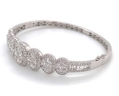 Great gift for an upcoming anniversary, wedding day, or just everyday wear. Delicately crafted in 18K White Gold will full cut round brilliant diamonds.Metal: 18K White GoldDiamonds: 246 Full Cut Round Diamonds 3.62ctw , 12 Baguette Cuts 0.52ctwDimensions: W: 13mm Pave Bangle, Baguette Cut, Anniversary Wedding, Brilliant Diamond, White Gold Diamonds, Round Brilliant, Bangle Bracelet, Round Diamonds, Gold Diamond