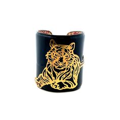 Unusual 14K Yellow Gold Patent Leather Tiger Cuff Bracelet  A perfect gift for your loved one!  Total Cuff Weight: 29.94g Cuff Length: Approximately 6inches  Cuff Width: 71.42mm Cuff Closure: Metal Stud Closure  Item will be placed in a gift box. * Luxury Gold Bangle Leather Bracelet, Designer Cuff Bracelet Bangle As Gift, Designer Cuff Bangle As Gift, Luxury Yellow Gold Leather Bracelet As A Gift, Unique Yellow Gold Cuff Bracelet For Gift, Designer Gold Cuff Bracelet Gift, Designer Gold Cuff Bracelet As Gift, Designer Adjustable Leather Bracelet, Luxury Handmade Cuff Bangle