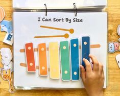 a person is holding an item in front of a calendar that says i can sort by size