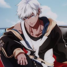 a man with white hair sitting on top of a red car