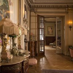 an ornate entry way leading into a living room