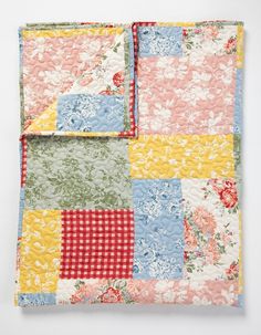 a patchwork quilt with flowers on it