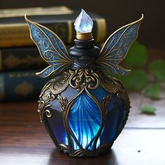 a blue glass bottle sitting on top of a wooden table