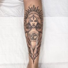 a woman's leg with a tattoo on it and a globe in the middle